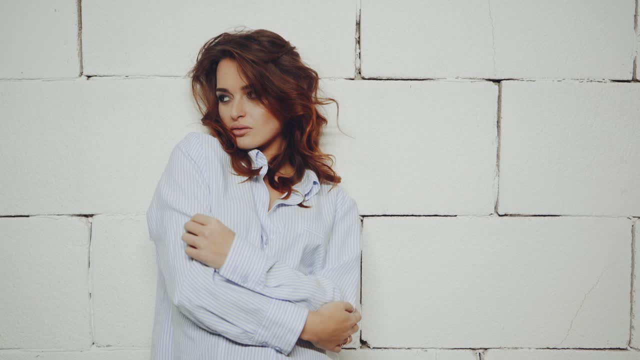 Portrait of model woman. Female model in stylish clothes posing in studio