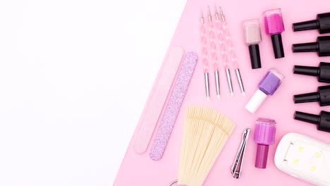 manicure tools appear on pink side of pink white theme. stop motion