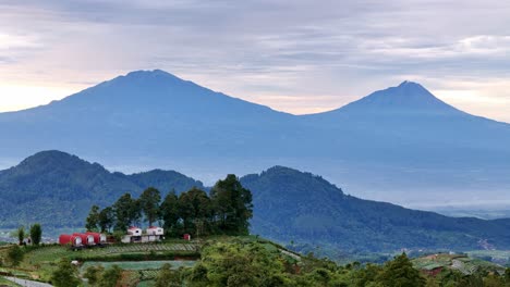 aerial scenery of nature countryside with mountain hills landscape. the house on the top of highland, indonesia.