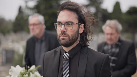 funeral, death and man carry coffin with family