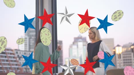 animation of balls and stars in usa flag colours over diverse woman talking