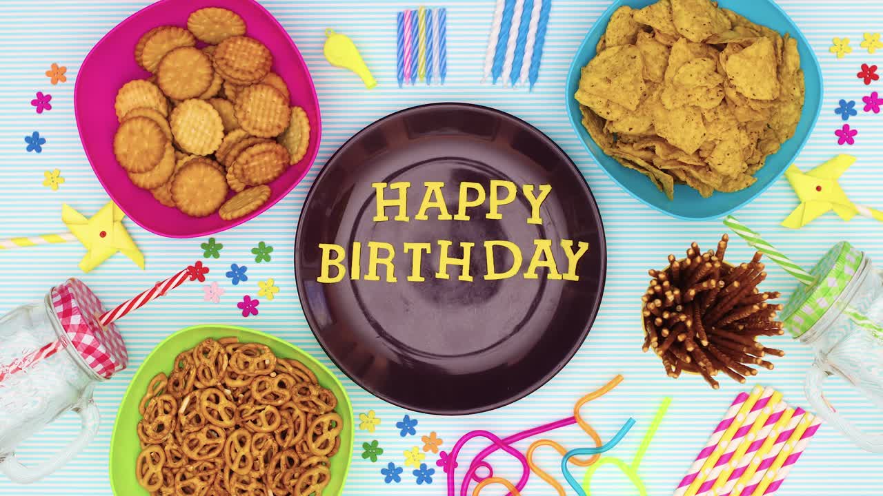 Eating cup cakes from the table with birthday party decorations and Happy birthday title appear - Stop motion