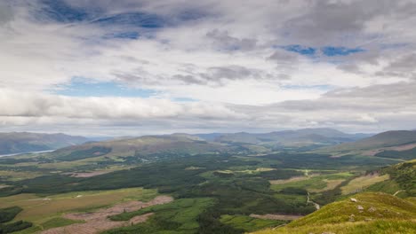 timelapse of view from ben nevis mountain in scotland, looking over fields with clouds