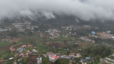 picturesque view of kodaikanal's valleys dotted with homes and winding roads