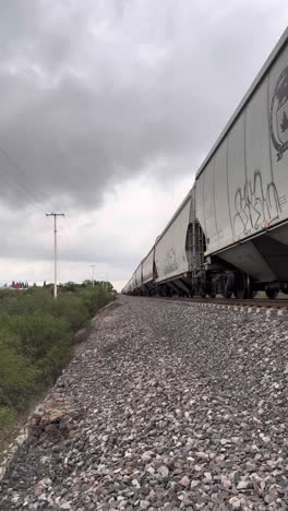 the train is crossing the desert into the mountains