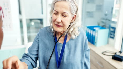 Doctor,-woman-and-listening-with-stethoscope-to