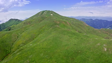 aerial view of green hill on top of mountain