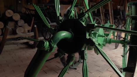 panning view of vintage agricultural equipment coloured in green