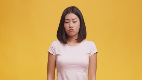 disappointed asian woman