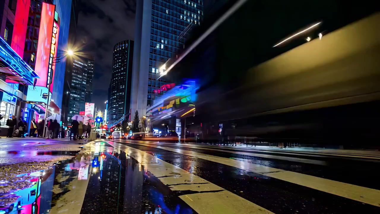 Time Lapse of Busy City Street at Night with Green Screen Billboard