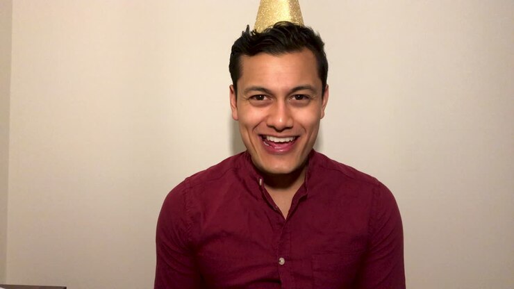 Young Man On Video Call Countdown to New Year and Celebrating with Party Popper