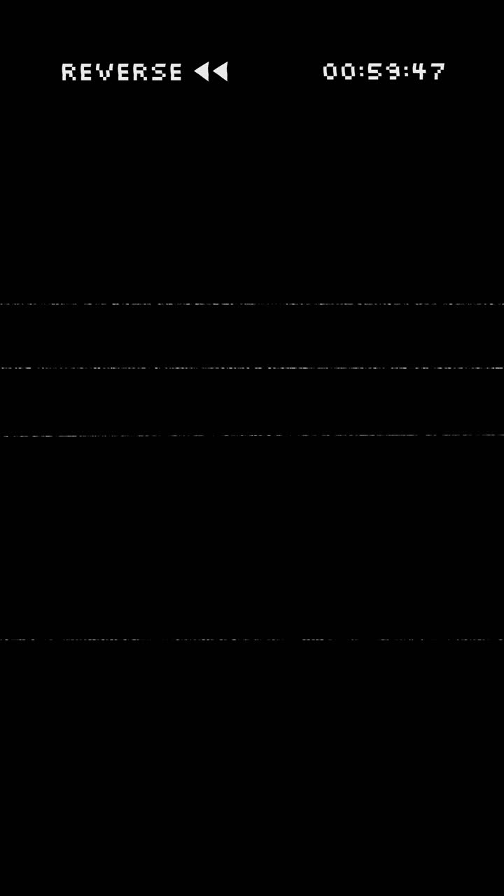 VHS Reverse Playback with Static and Timecode Overlay