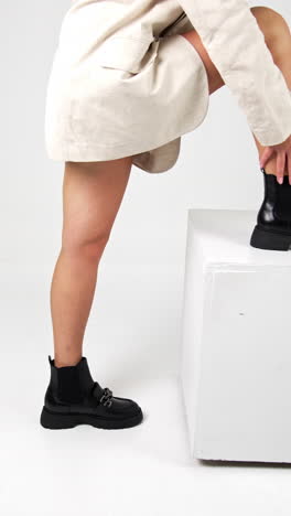 women shoe store showroom trying. fashionable luxury lifestyle footwear posing. vertical video