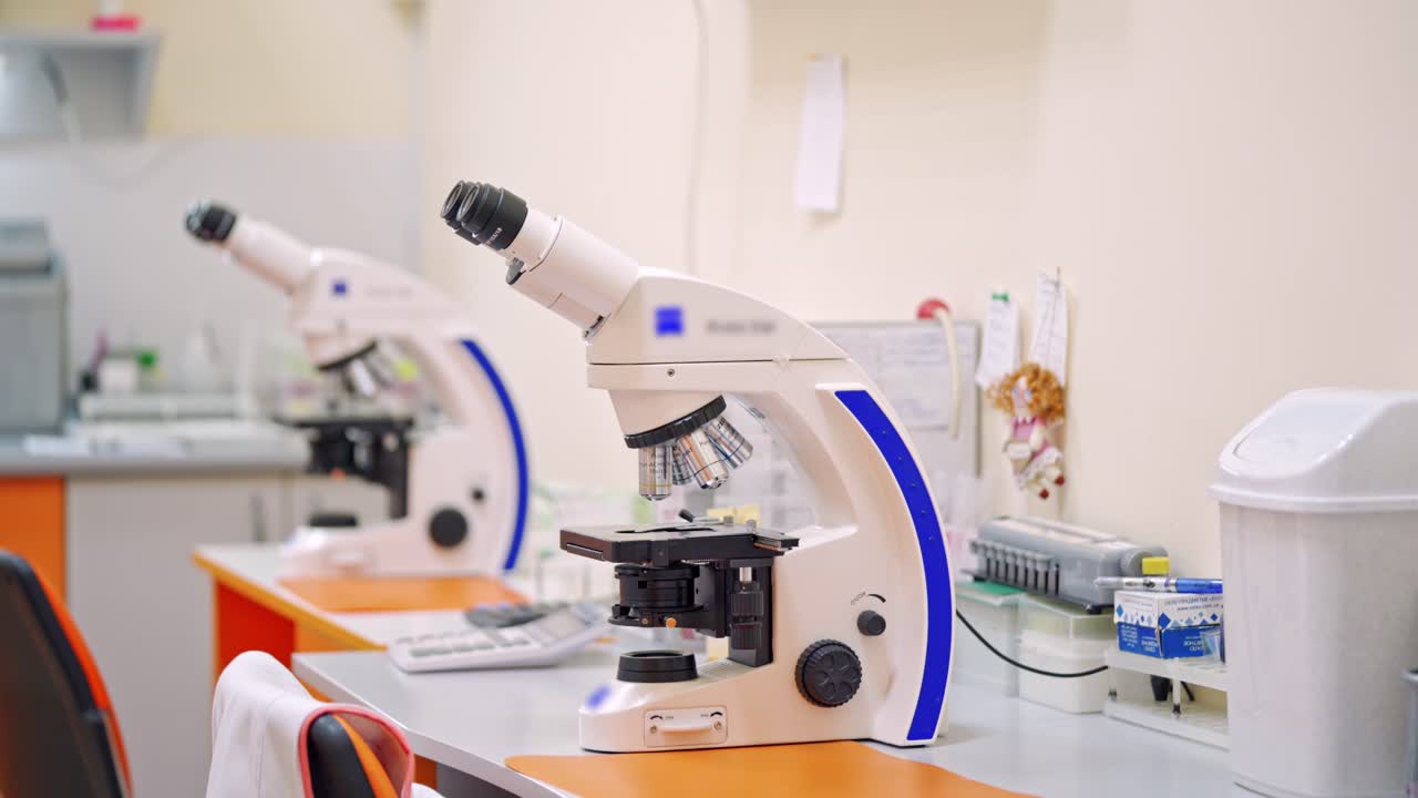 Contemporary microscope in lab. Medical equipment to make scientific researches in the laboratory. Science, profession, healthcare. Chemical reactions.