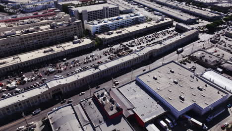 aerial view of a bustling outdoor market in an urban area