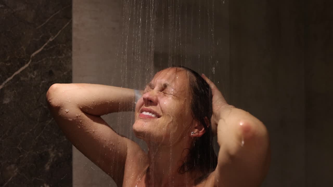 A woman enjoying a refreshing shower