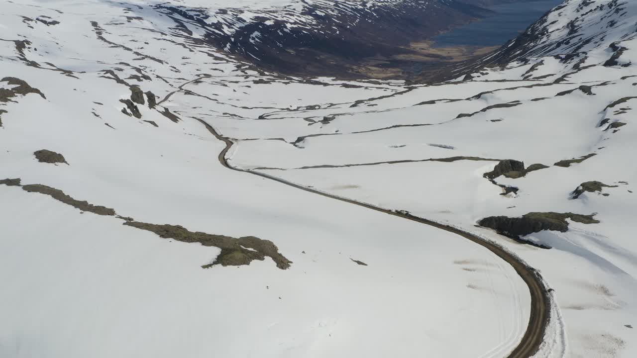 Aerial View of a Snow Covered Mountain Valley in Iceland