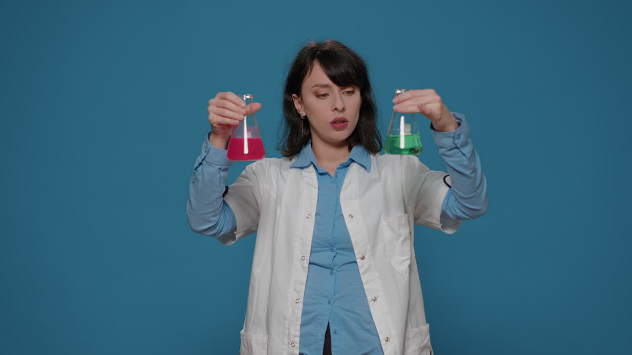 Scientific specialist analyzing liquid formula in glass beaker