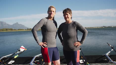 portrait of two senior caucasian women standing by a river