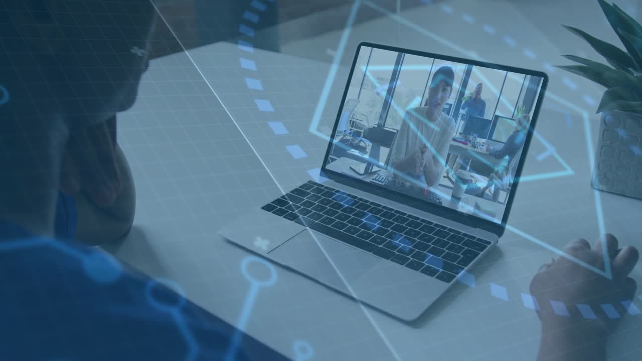Viewer leaning, pointing at keyboard as laptop host speaking, HUD showing business data for work