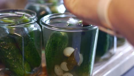 cucumbers are placed in a glass and filled up with broth