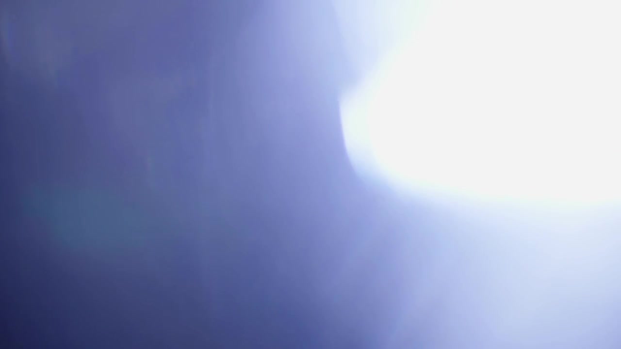 Abstract Blue Light Leak and Lens Flare Transition
