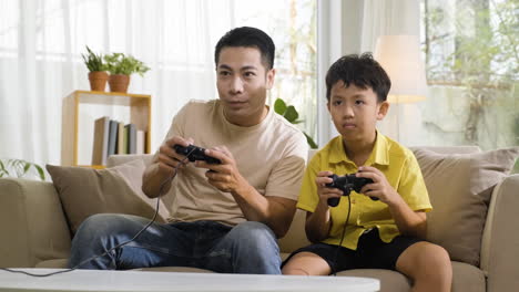 asian man and boy in the living room