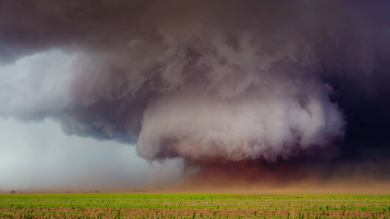 Destructive Tornado Funnel Approaching Small Farm and Crops
