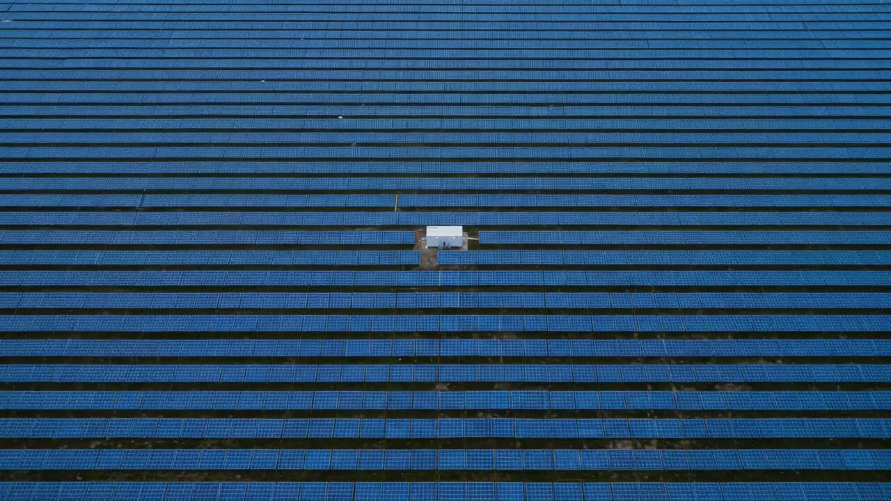 Aerial View of Solar Panel Installation: Captivating Rows of Solar Energy Panels with a Distinct Gap Highlighting Innovative Renewable Energy Solutions