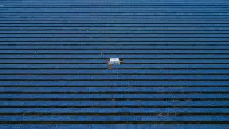 aerial view of solar panel installation: captivating rows of solar energy panels with a distinct gap highlighting innovative renewable energy solutions