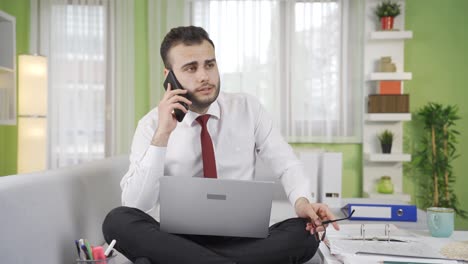 Businessman-talking-on-the-phone-with-people-he-doesn't-like.