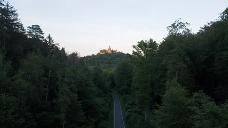 Drone-flight-among-the-woods-flying-away-from-Braunfels-castle-in-germany