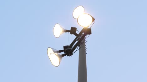 Baseball-Stadium-Spotlights---Low-Angle-Park-Lights-against-Clear-Blue-Sky-Background