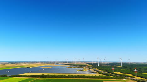 yellow and green fields with numerous wind mills. countryside landscape used for wind farms. aerial view