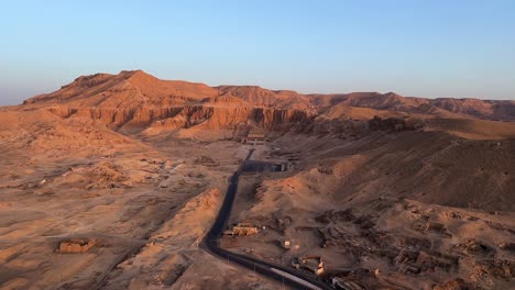 Fly-over-Luxor,-Valley-of-the-Kings-in-Egypt-in-a-Hot-Air-balloon-at-sunrise-overlooking-historical-sites