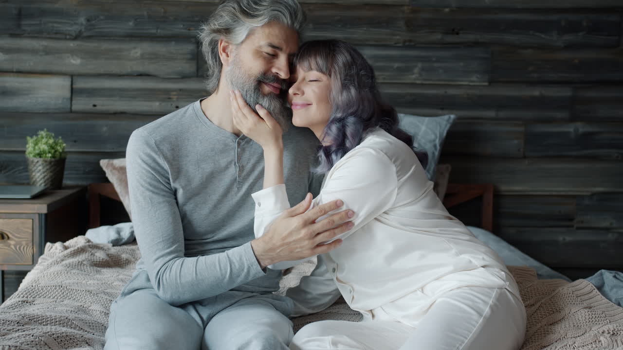 Affectionate Senior Couple in Bed
