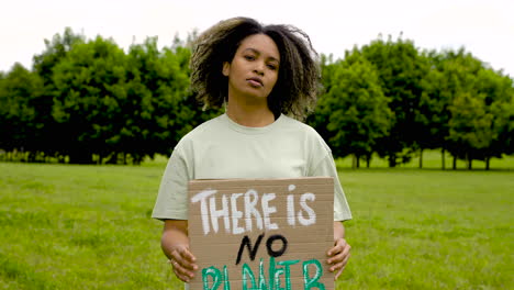 close up of an woman holding a placard