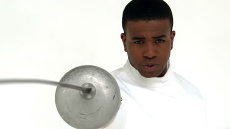 man practising fencing