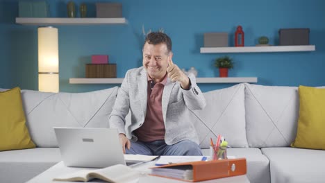 Home-office-worker-man-making-positive-gesture-at-camera.