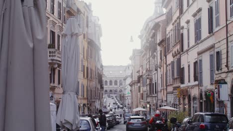 roman street view with colosseum in the background