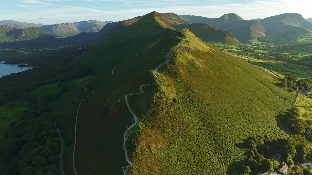 Drone footage flying towards the Cat Bells ridge hiking trail in the Lake District, UK during golden hour