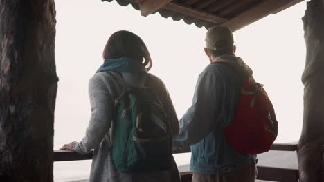 couple enjoying a scenic view from a mountain lookout