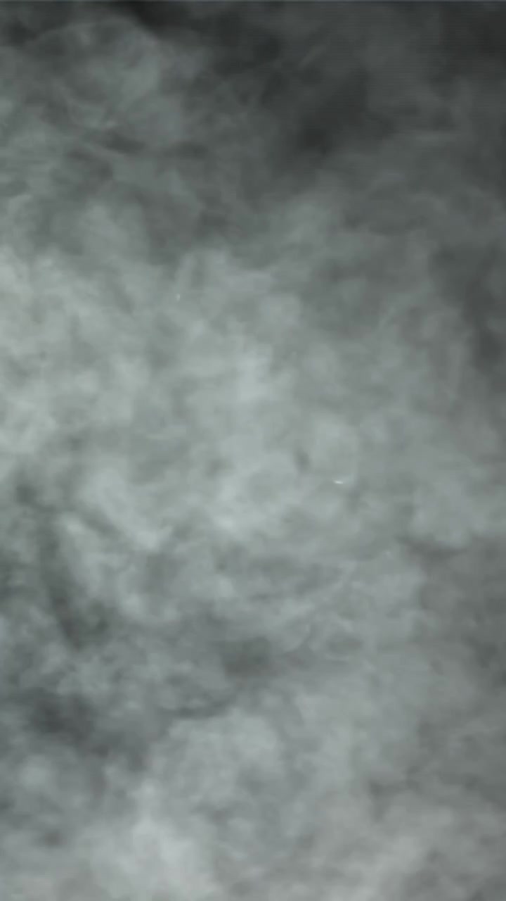 Atmospheric Gray Smoke Swirling and Dissipating on Dark Background