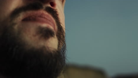 athlete practicing breathing exercises on nature closeup. man meditating outside