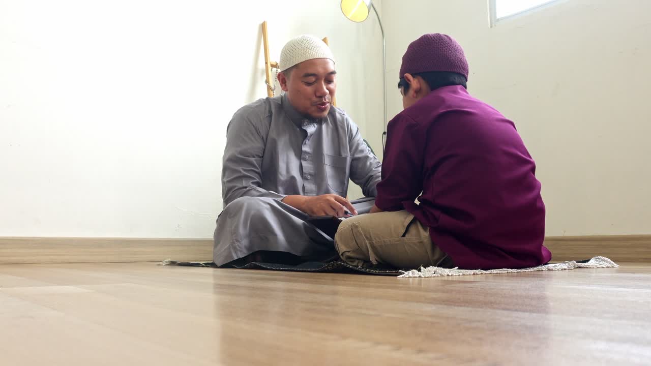 Indonesian Muslim Father Teaching His Son To Read The Quran