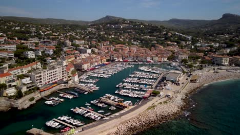 drone approaching shot of large marina in cassis in france on a sunny day