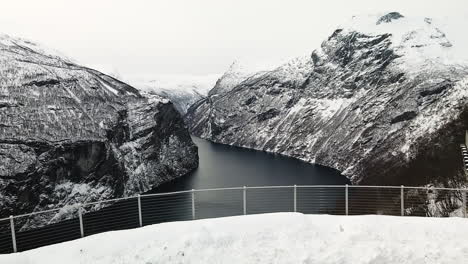 aerial view of snowy lookout point of ornesvingen and geiranger fjord in norway