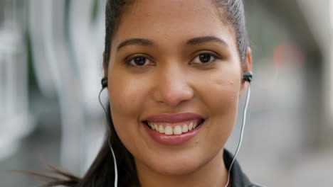 Mixed-woman-enjoying-music-while-listening-through