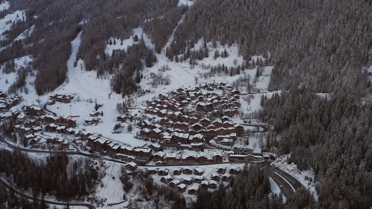 Wintersport village during a winter sunset. Aerial shot
