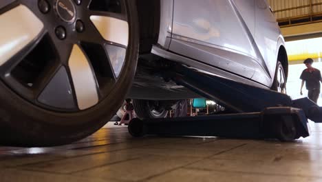 car under lift in garage